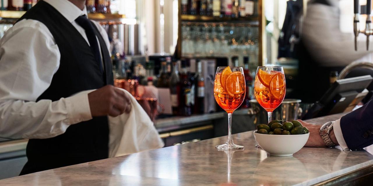 Hotel Diplomat Стокхолм Екстериор снимка A bartender wiping down the bar